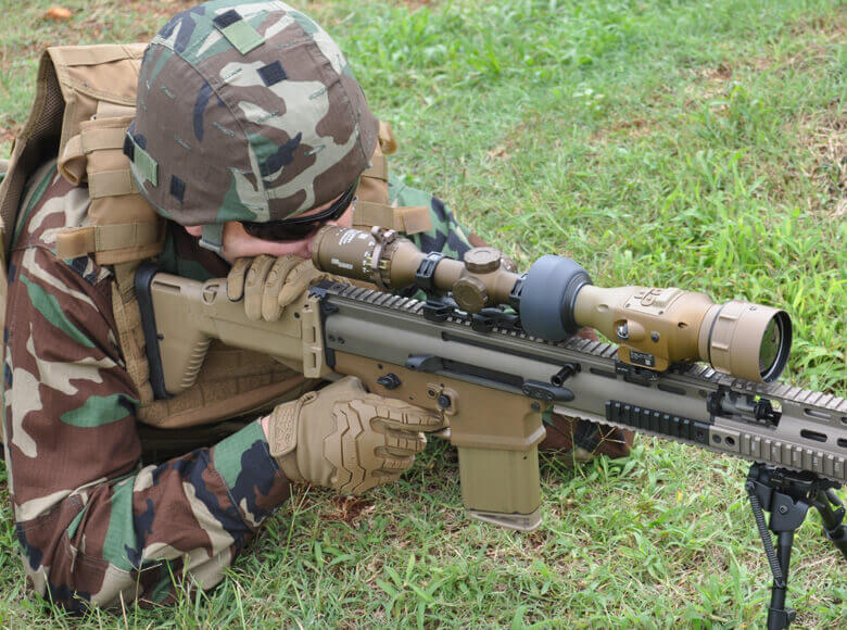 soldier using IWS weapon sight