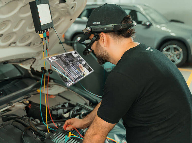 Auto mechanic wearing headset