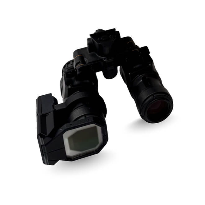 Close-up of the DarkWAVE™ clip-on augmented reality module attached to night vision goggles, illustrating the device's compact form factor and integration with existing NVG systems.