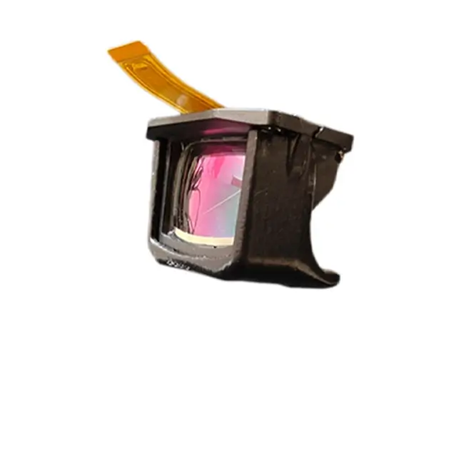 A compact augmented‑reality optical module with a pink‑tinted see‑through lens and an attached flexible orange connector, shown against a white background.